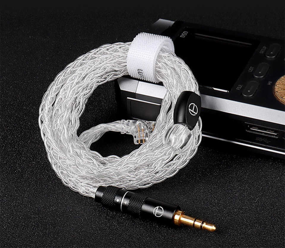 Rolled up TRN T3 Pro cable next to MP3 player
