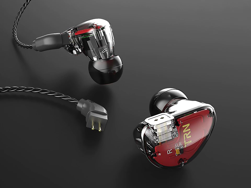 TRN V30 Two carbon earphones on a dark background