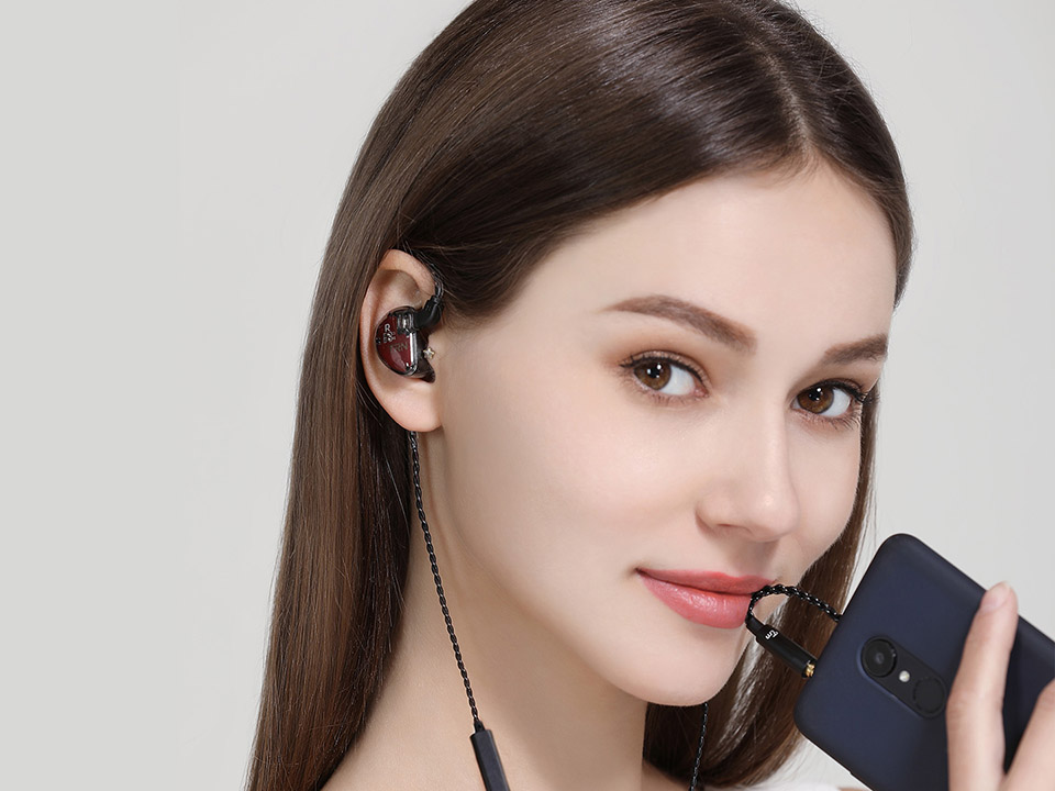 A woman with earphone TRN V30