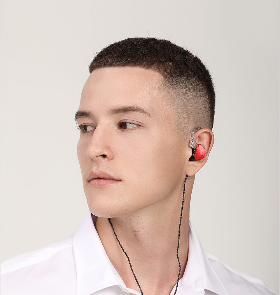 Crimson red TRN V90S earphone in man's ear front view